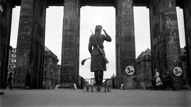A Soviet Red army woman soldier controls traffic in front of the Brandenburg Gate in July 1945 in Berlin. (AFP)