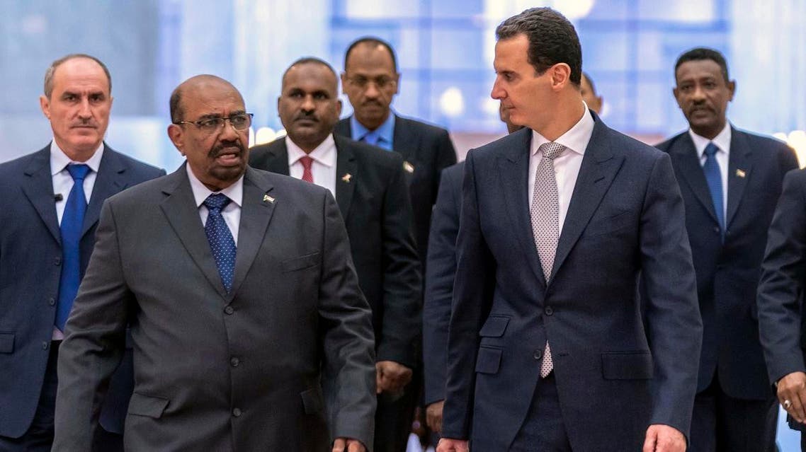 In this photo released by the Syrian official news agency SANA, Syrian President Bashar Assad, right, meets with Sudan's President Omar al-Bashir in Damascus, Syria. (SANA via AP)