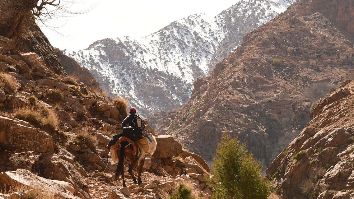 A Morroccan man on his donkey heads to his village Taghzirt, in el-Haouz province in the High Atlas Mountains south of the capital of Marrakech, on March 3, 2016. When using well-known search engines, one can find very few information about Taghzirt village. And while tourists from all around the world enjoy the sun warm days and the snow-covered view of the nearby mountains from Marrakesh, hundreds of villagers suffer from the harshness of winter and isolation, due to the state of the roads leading to it. Many villagers find it hard to access food, medical health and education.