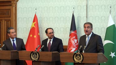 Afghanistan Foreign Minister Salahuddin Rabbani, center, and Chinese Foreign Minister Wang Yi, first left, listen as Pakistan’s Foreign Minister Shah Mehmood Qureshi speaks during a joint press conference in Kabul on Dec. 15, 2018. (AP)