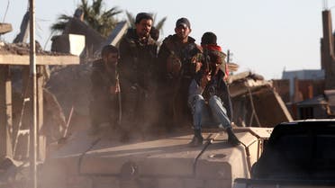 عناصر من سوريا الديمقراطية في هجين(15 ديسمبر- فرانس برس)