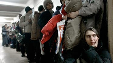 A Romanian woman at the International Office for Migration in Bucharest, Romania, on Jan. 28, 2004, waiting in a line to apply for a job in Spain. (AP)