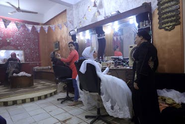 Nadia Mohammad Salem is seen at a hair salon on her wedding day, in Cairo. (Reuters)