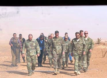 In this image made through a vehicle window, U.S. Gen. Joseph Votel, the top U.S. commander in the Middle East, center, arrives for an unannounced visit Monday, Oct. 22, 2018, at the al-Tanf military outpost in southern Syria. (File photo: AP)