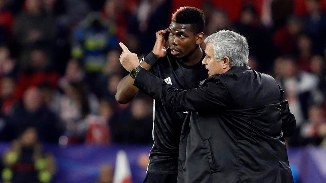 Manchester United manager Jose Mourinho, right, talks to Manchester United's Paul Pogba during the Champions League round of sixteen first leg match. (File photo: AP)