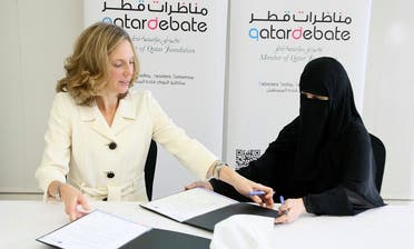 Qatar Foundation International's Executive Director, Maggie Mitchell Salem, signed a collaboration agreement in Doha yesterday with the Executive Director of QatarDebate, Dr. Hayat Maraafi. (Photo via Qatar Foundation International/Facebook)