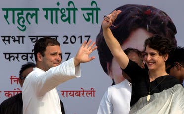 Congress party Vice President Rahul Gandhi, left, and his sister Priyanka Vadra wave to supporters during an election campaign rally in Rae Barelli 2017. (AP)