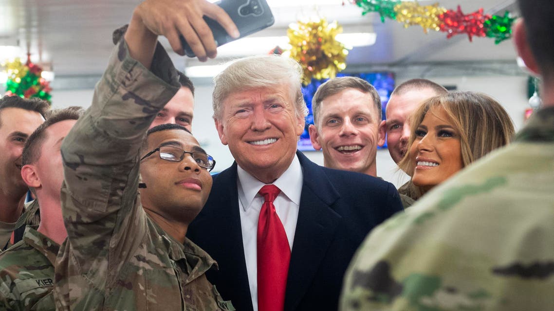 President Trump and Melania greet members of the US military during unannounced trip to Al Asad Air Base in Iraq on December 26, 2018. (AFP)