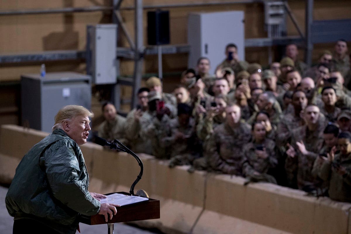 Trump visits US troops in Iraq. (AP)