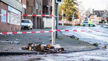 A picture taken on January 1, 2019 in Bottrop shows a cordoned off area at the site where a man injured four people after driving into a group celebrating the new year, in what police described as an anti-migrant attack. (AFP)