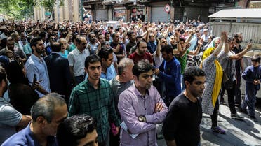 Protesters chant slogans at the old grand bazaar in Tehran on June 25, 2018. (Iranian Labor News Agency via AP)