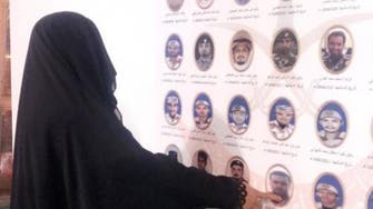 At wall of honor, Saudi martyr’s mother soaks his picture in tears