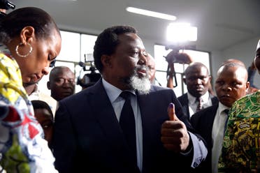 Democratic Republic of Congo's President Joseph Kabila displays ink on his hand after casting his vote at a polling station in Kinshasa. (Reuters)