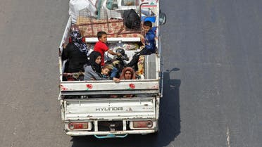 Residents of the Idlib province flee toward the Syrian Turkish border on September 10, 2018. (AFP)