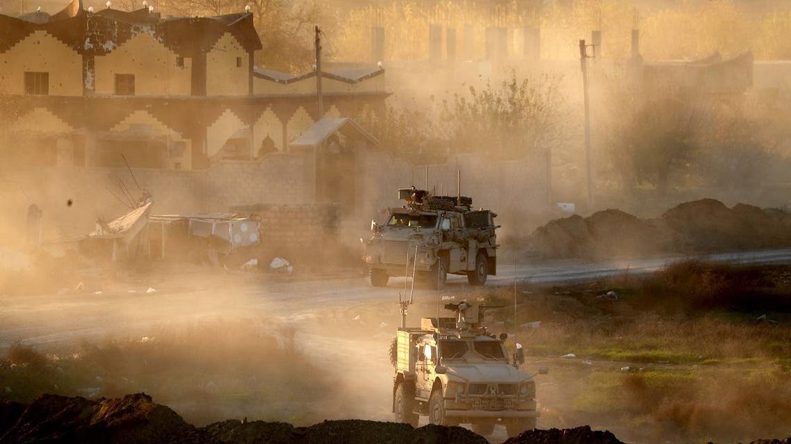 US army vehicles supporting the Syrian Democratic Forces (SDF) in Hajin, in the Deir Ezzor province, eastern Syria, on December 15, 2018 (AFP)