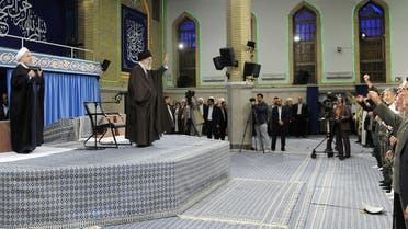 Iran’s Supreme Leader Ayatollah Ali Khamenei and Iranian President Hasan Rouhani (L) at a ceremony in Tehran on April 14, 2018. (AFP)