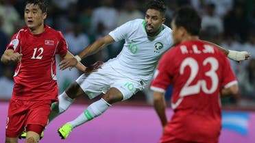 Saudi midfielder Salem al Dawsari (right), shoots to score his side’s third goal during the AFC Asian Cup group E soccer match against North Korea  in Dubai on January 8, 2019. (AP) 