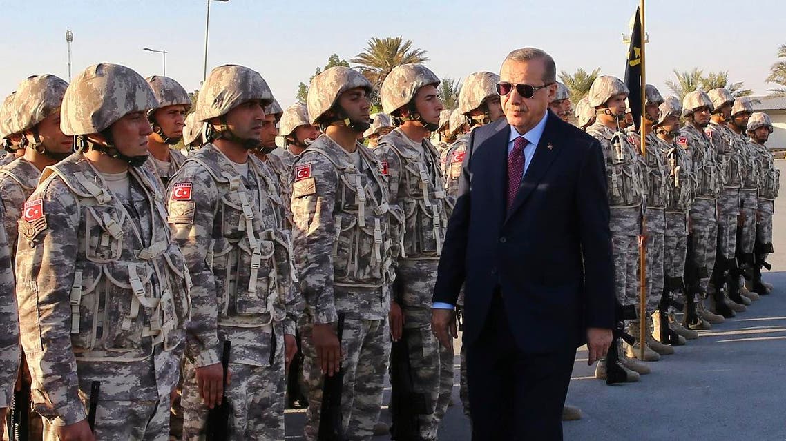 Turkey's President Recep Tayyip Erdogan, right, visits Turkish Armed Forces's soldiers, during his visit at the Qatari-Turkish Armed Forces Land Command Base in Doha, Qatar. (File photo: AFP)
