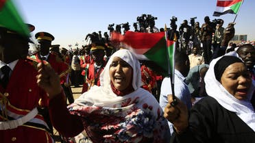 Supporters of Sudan’s President Omar al-Bashir wave Sudanese flags during a rally for him in Khartoum on January 9, 2019. (AFP)