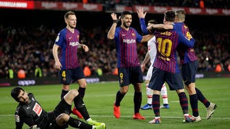 Suarez, Messi lead Barca to 3-0 win over Eibar to keep lead