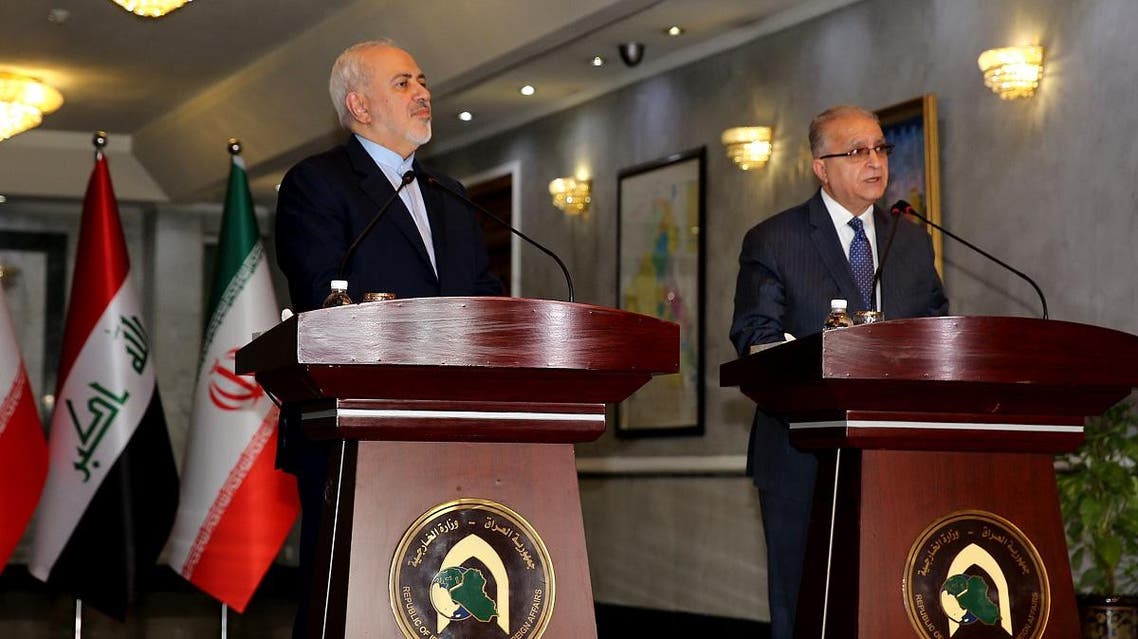 Iran's Zarif and Iraq's al-Hakim (AFP)