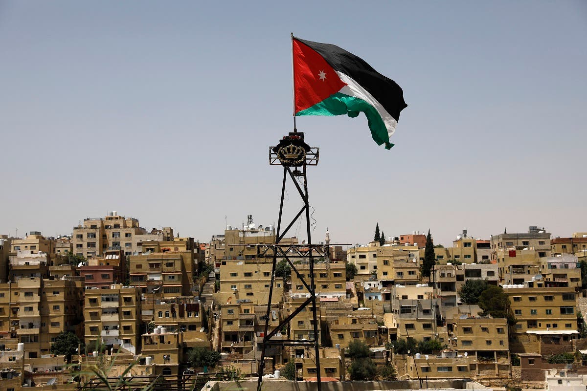 A Jordanian flag flies above Amman. (AFP)