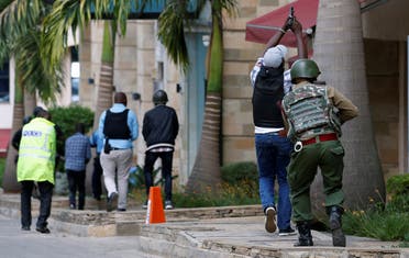 Members of security forces are seen at the scene where explosions and gunshots were heard at the Dusit hotel compound, in Nairobi. (Reuters)