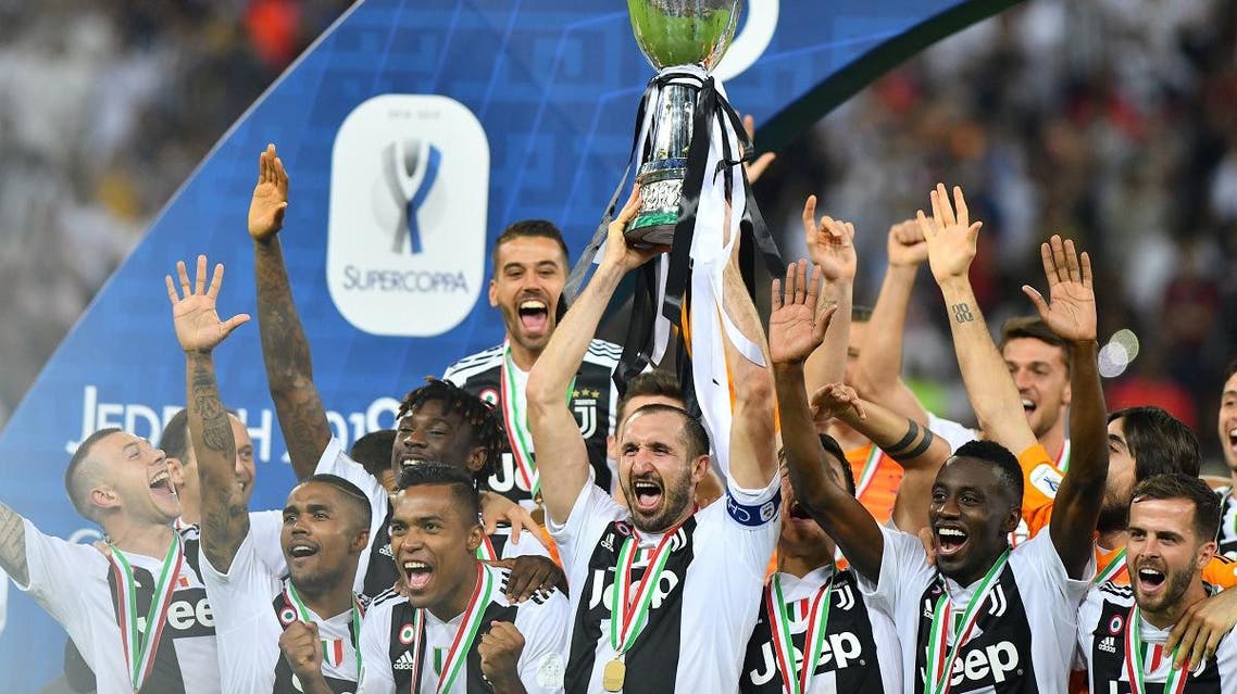 Juventus' Giorgio Chiellini celebreates with the trophy after winning the Italian Super Cup. (Reuters)