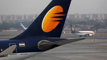 A Jet Airways plane is parked as another moves to the runway at the Chhatrapati Shivaji International airport in Mumbai, India. (Reuters)