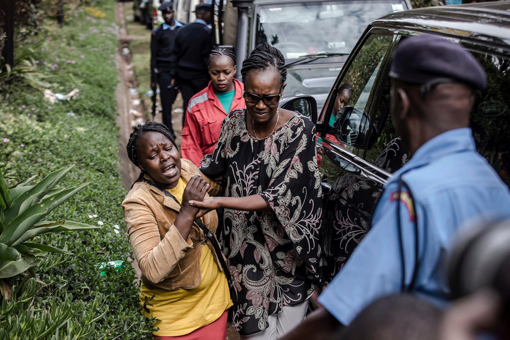 A woman is rescued at the scene of an on going terrorist attack at a hotel complex in Nairobi (AFP)