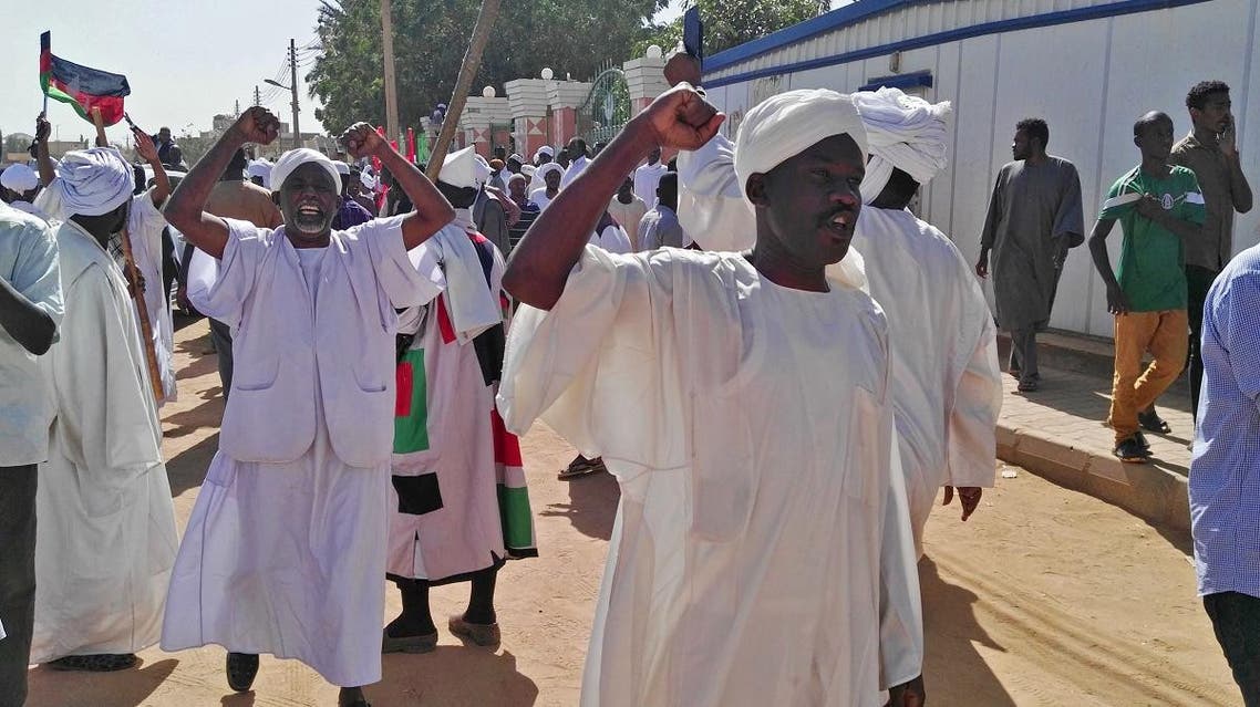 Sudanese men shout slogans during an anti-government protest following Friday noon prayers on Jan. 18. (Reuters)