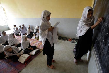 Afghan fourth graders learn to read and write in Pashto at an all-girls school Tuesday, March 23, 2010, in Nangarhar province of Afghanistan. (AP)