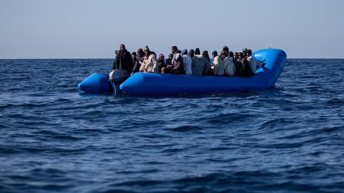 An unflatable boat with 47 migrants on board is pictured while being rescued by the Dutch-flagged Sea Watch 3 off Libya's coasts on January 19, 2019. The German charity group Sea Watch said on January 19 that it had rescued 47 migrants from an inflatable boat, but it was not known if they belonged to the same group that was feared missing off the Libyan coast, the International Organization for Migration said on January 19 after the Italian navy flew three survivors to the Mediterranean island of Lampedusa.