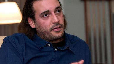 محامي نجل القذافي: يعاني عدة آلام في جسده