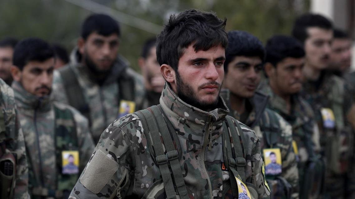 Fighters from the Syrian Democratic Forces (SDF) attend the funeral of a fellow fighter, who was killed while fighting against ISIS in the northeastern Syrian Kurdish-majority city of Qamishli on January 18, 2019. (AFP)