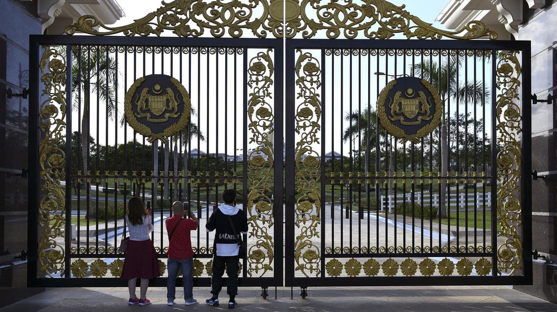 Tourists take pictures at the entrance of Malaysia’s National Palace in Kuala Lumpur on January 23, 2019. (AFP)