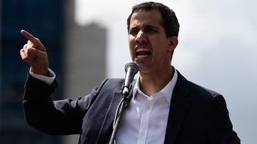 National Assembly head Juan Guaido speaks to the crowd during a mass opposition rally against Venezuela’s leader Nicolas Maduro in Caracas on January 23, 2019. (AFP)