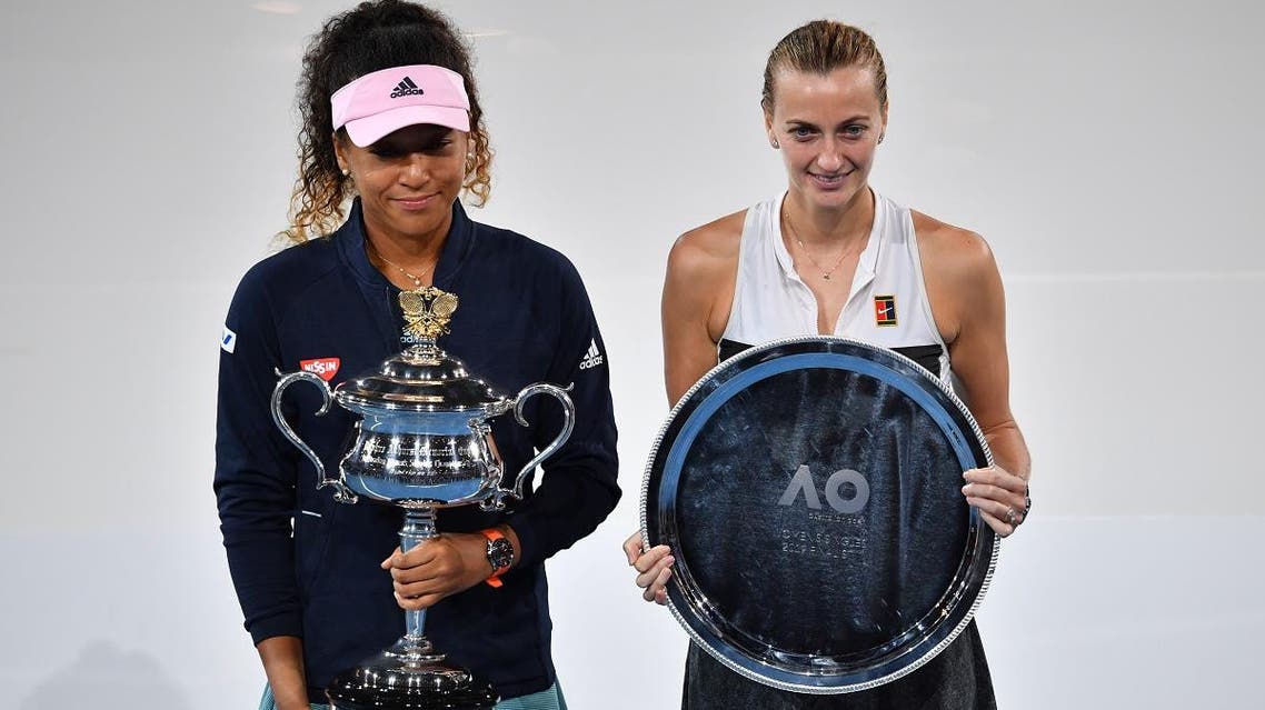 Naomi Osaka (L) poses with the Australian Open championship trophy after her victory against Czech Republic’s Petra Kvitova in the women’s singles final in Melbourne on January 26, 2019. (AFP)