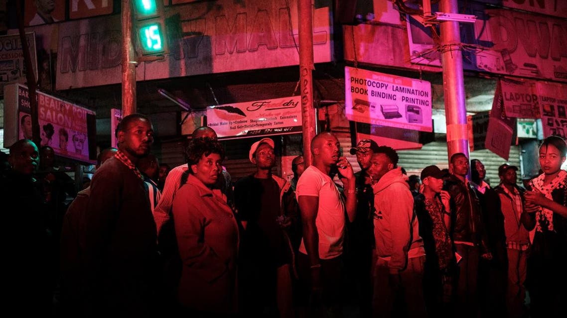 People look at the scene of a blast in the center of Nairobi. (AFP)
