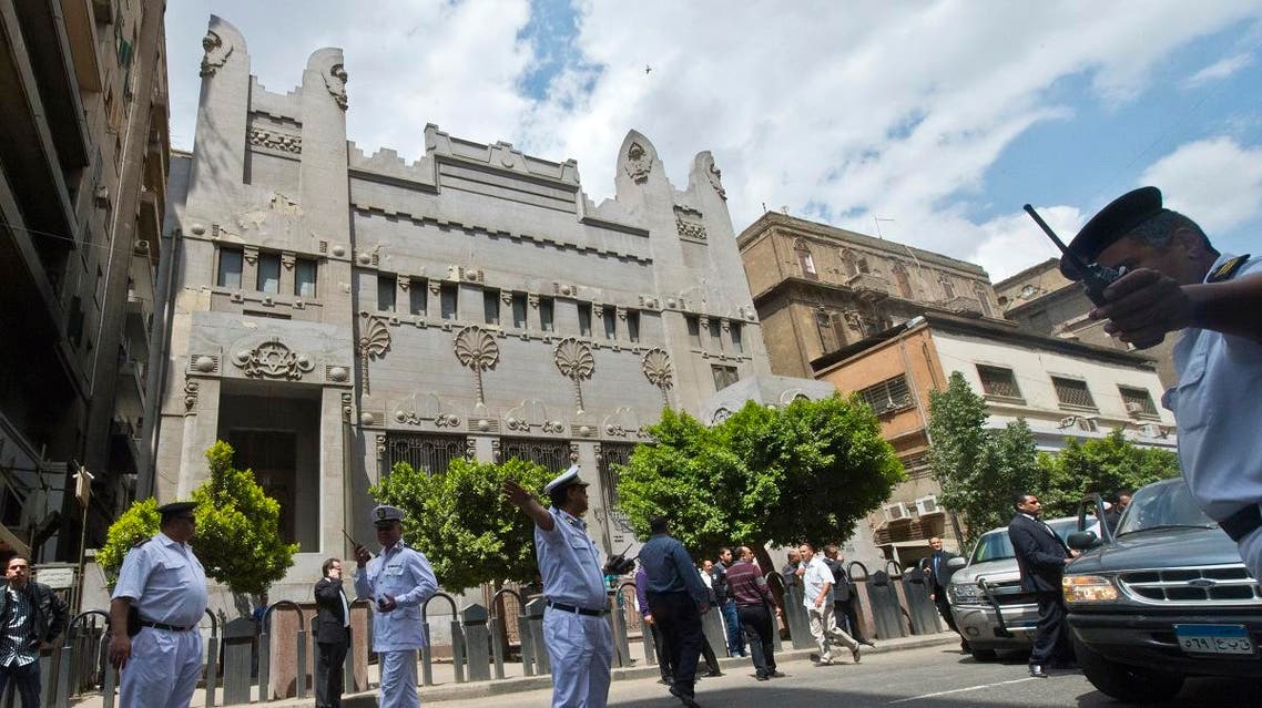 Security forces patrol as people arrive at the Adly Synagogue for the funeral of the president of the Egyptian Jewish Community Carmen Weinstein on April 18, 2013 in Cairo, Egypt. (AFP)