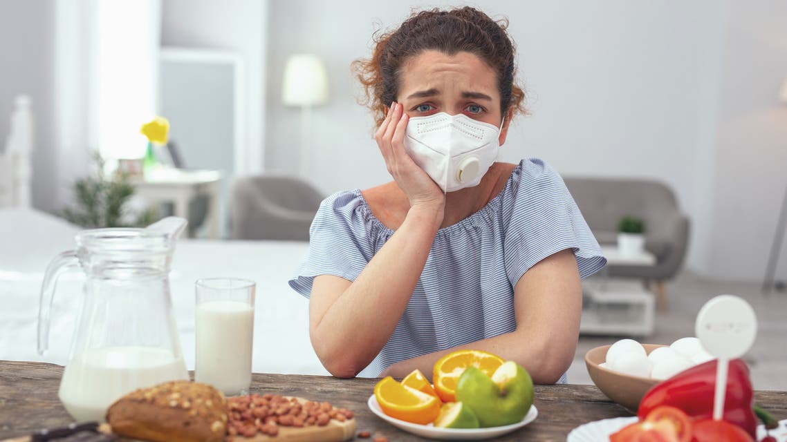 Young woman feeling upset about her multiple allergies - Stock image