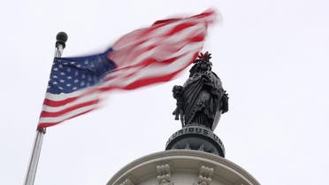 The U.S. flag flies near the Statue of Freedom atop the U.S. Capitol in Washington, U.S. November 2, 2018. REUTERS/Jonathan Ernst