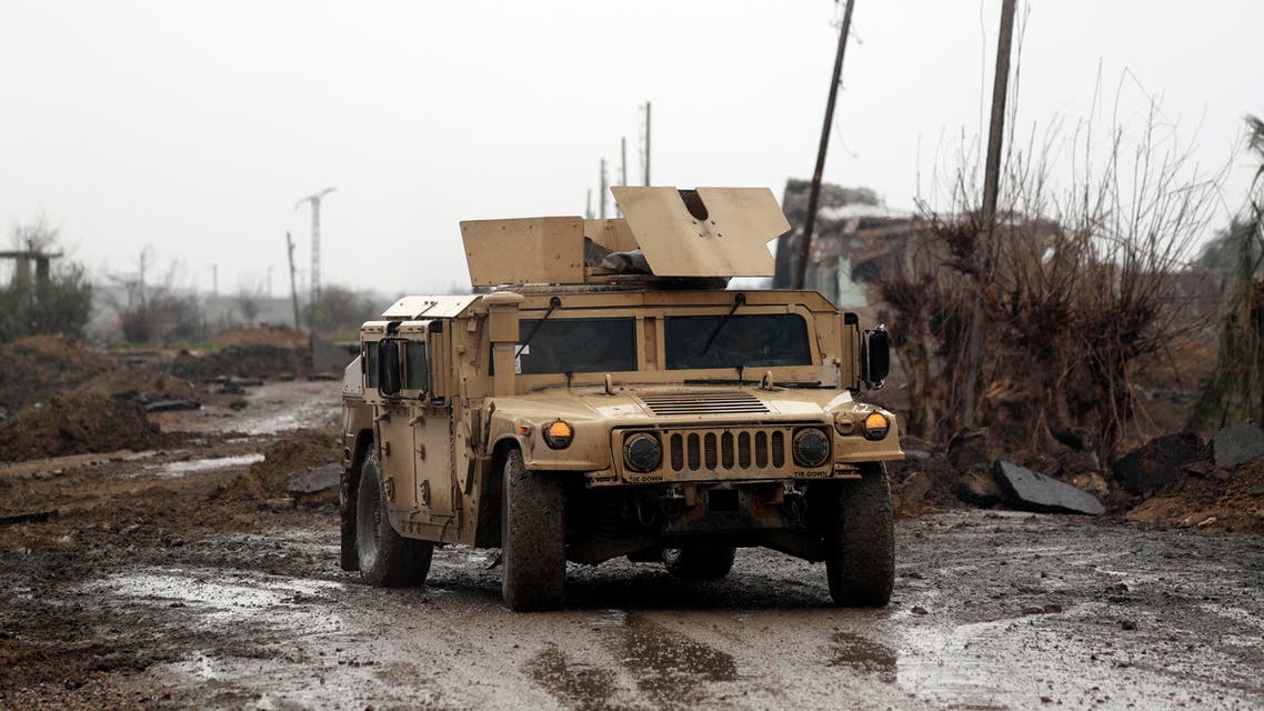 Syrian Democratic Forces (SDF) vehicles make their way on a dirt road on January 28, 2019, in the town of Sousa, in Syria's eastern province of Deir Ezzor. Kurdish-led fighters pressed their assault against the Islamic State group in eastern Syria Monday, boxing the jihadists into a tiny last pocket of land along the Euphrates River.