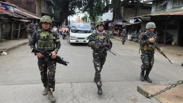 Philippine soldiers escort a hearse during the funeral procession of a victim killed in the January 27 cathedral bombing in Jolo, Sulu province. (AFP)