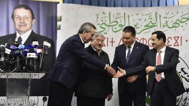 Amara Benyounes, Ahmed Ouyahia, Mouad Bouchareb, and Amar Ghoul, Algerian Ministers and representatives of the president-candidate Abdelaziz Bouteflika, shake hands after a political meeting in the capital Algiers on February 2, 2019. (AFP)
