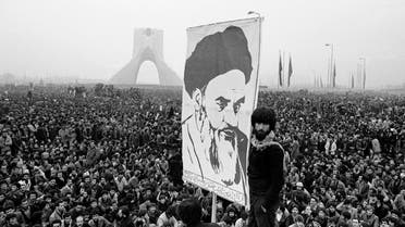 Demonstrators hold up a poster of exiled Muslim leader Ayatollah Ruhollah Khomeini during an anti-shah demonstration in Tehran, Iran on December 10, 1978. (AP)