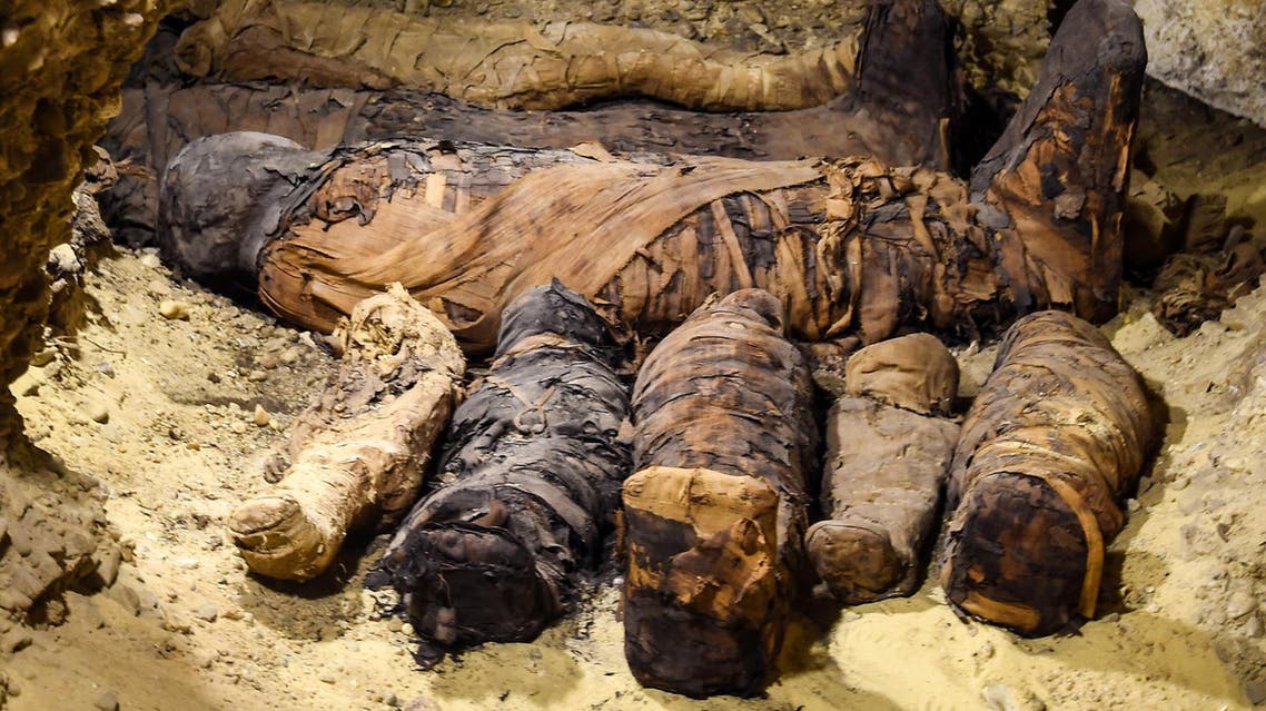 Egyptian archaeologists uncovered a tomb containing 50 mummies dating back to the Ptolemaic era, in Minya, south of Cairo. (AFP)