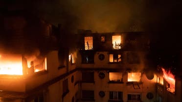 A fire in a Paris apartment building early Tuesday that authorities suspect was an arson attack, killed seven people. (AP)