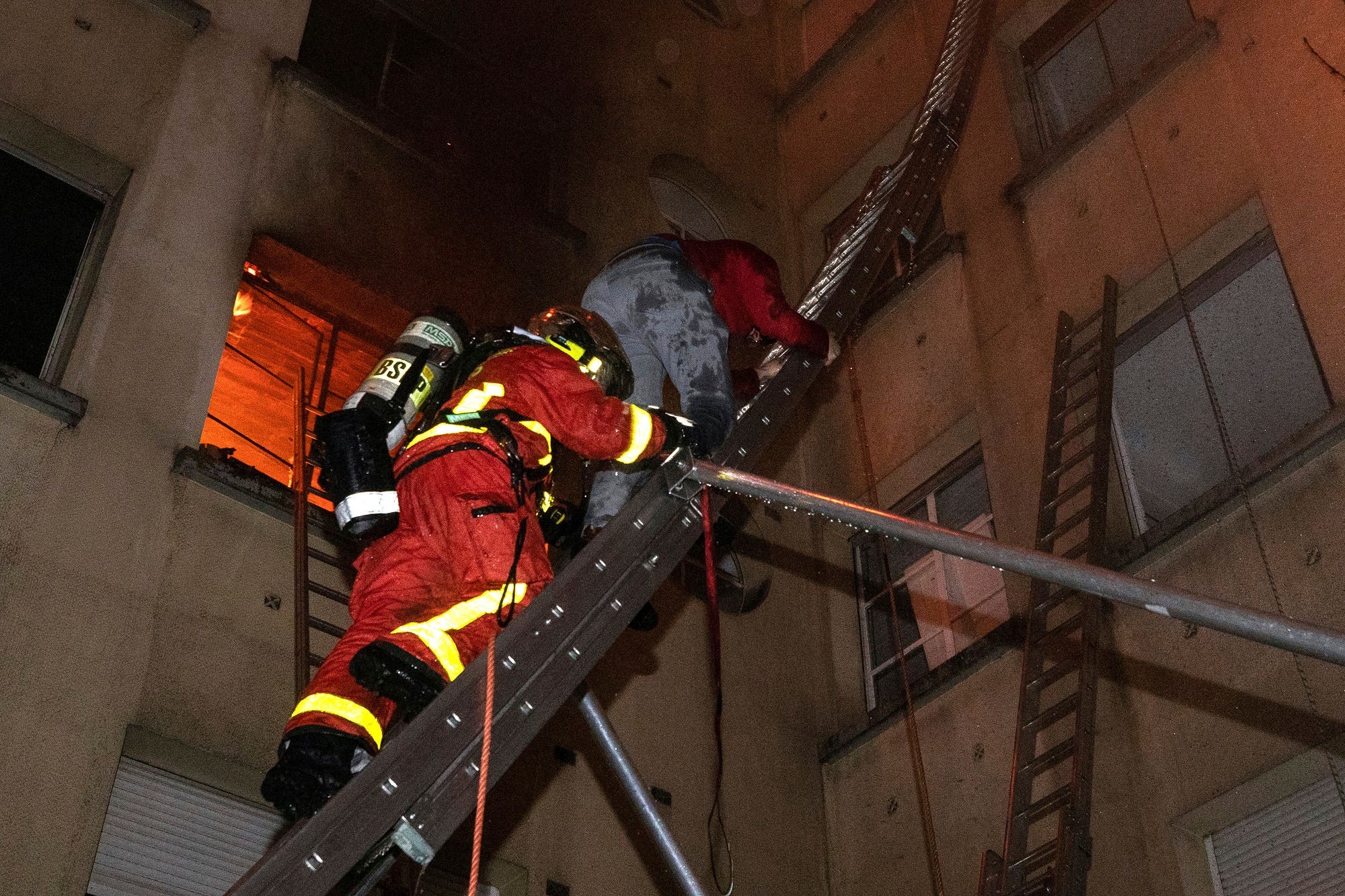 One person is in life-threatening condition and 30 others were injured in the blaze. (AP)