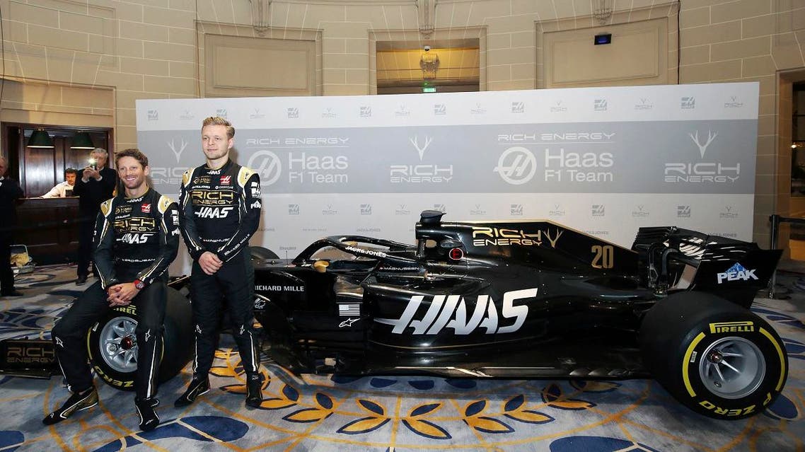 Drivers Romain Grosjean and Kevin Magnussen pose during the unveiling of their new Rich Energy Haas F1 Team 2019 car. (AP)